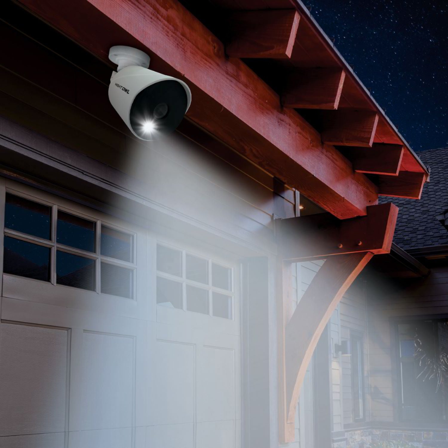 Home security camera above garage at night