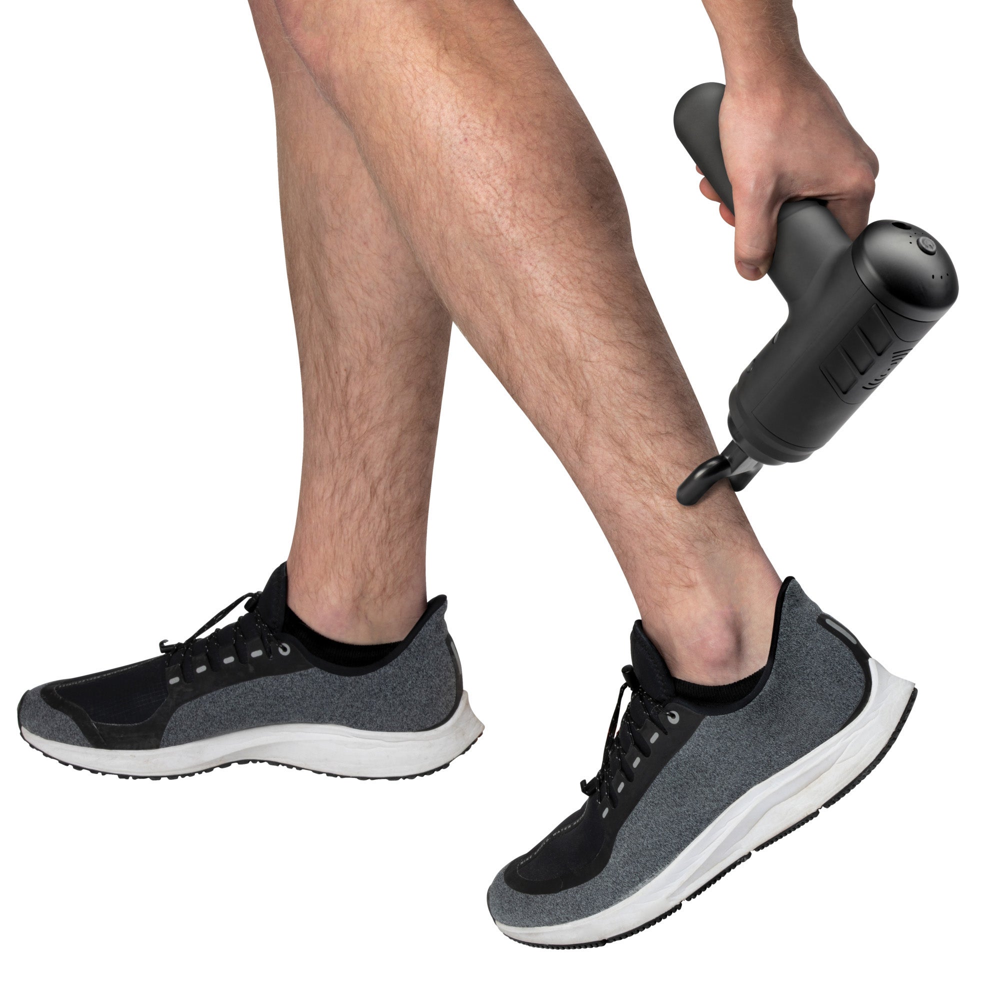 Man using percussion massager on leg