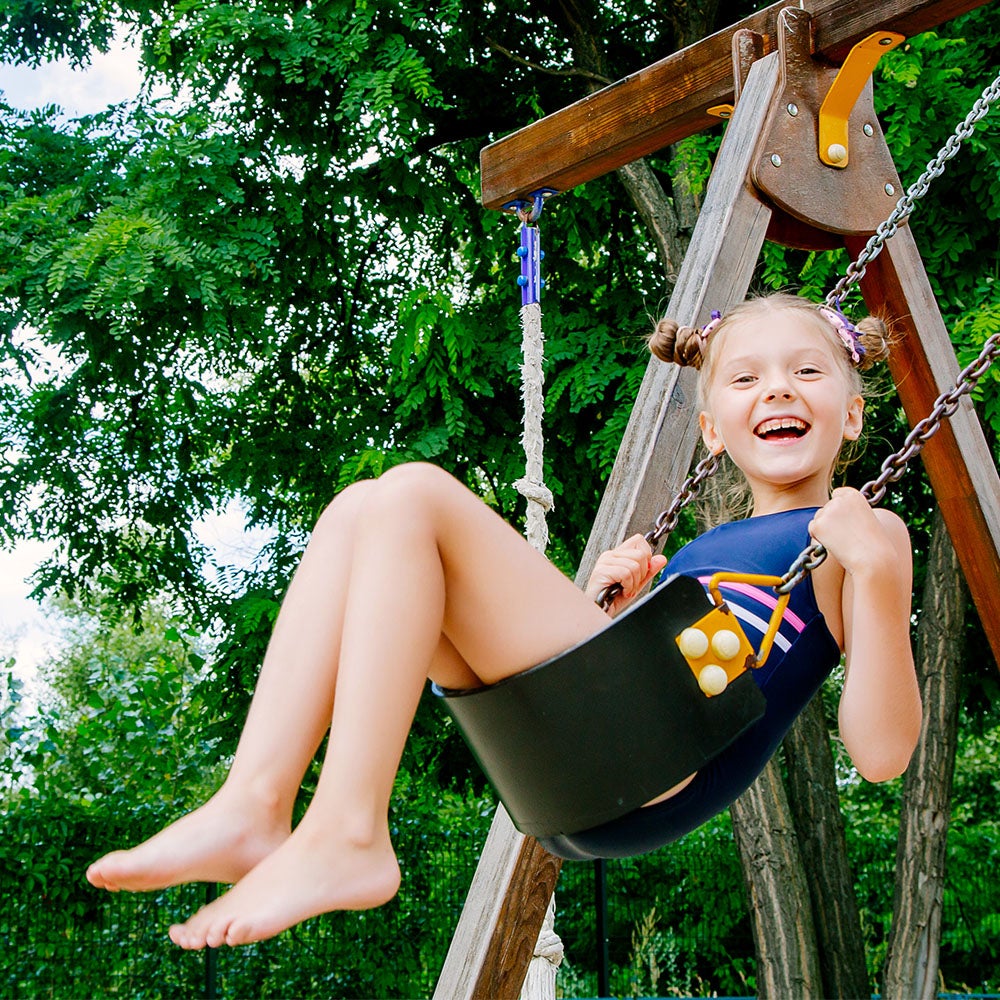 Little girl on swing